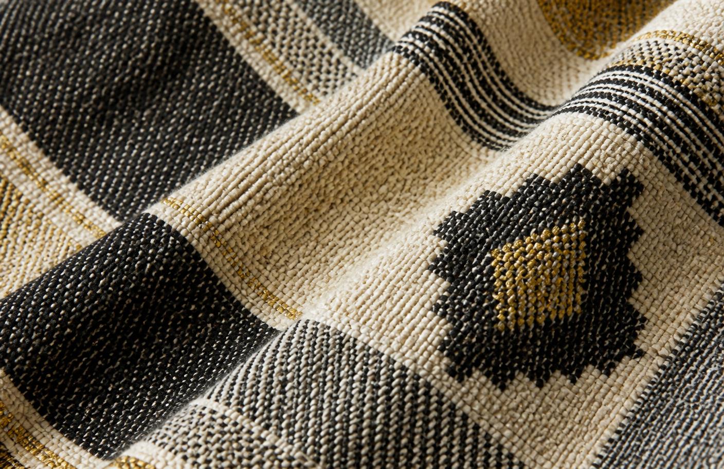 Handwoven African textile in ivory, charcoal and antique gold threads